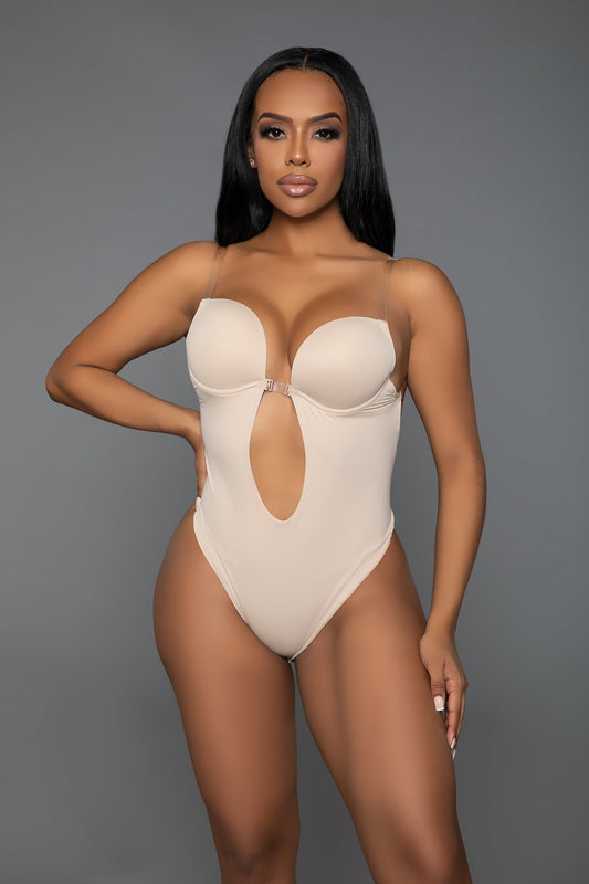 Embrace a stunning silhouette with our Looking Curvy Bodysuit Shaper. Designed with a deep U-neckline, this bodysuit offers a seductive plunge while providing optimal support with its built-in lifting cups. The open-back design ensures a seamless fit under any outfit, making it perfect for backless dresses and tops. Flexible clear removable and adjustable straps Lifting underwire cups Deep U plunging neckline with front hook closure Open back Thong-style bottom