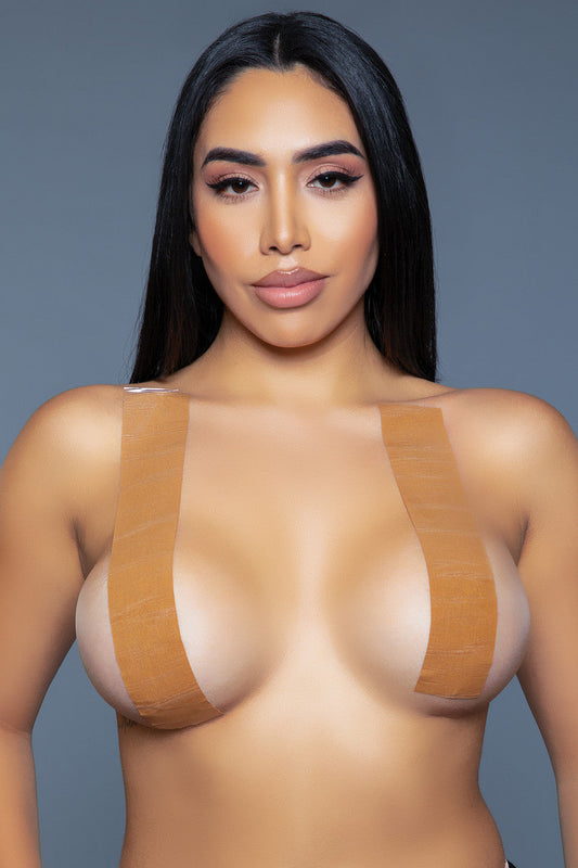 Revolutionize the way you wear your favorite outfits with our innovative and versatile lifting tape. Tailored for those who demand both functionality and a seamless blend with their wardrobe, this breast lifting tape provides an impeccable lift and support for any garment, thanks to its double-sided adhesive technology. Double side adhesive Single roll Wide tape provides support Follow care instructions Be Wicked box packaging 88% Chinlon 12% Spandex