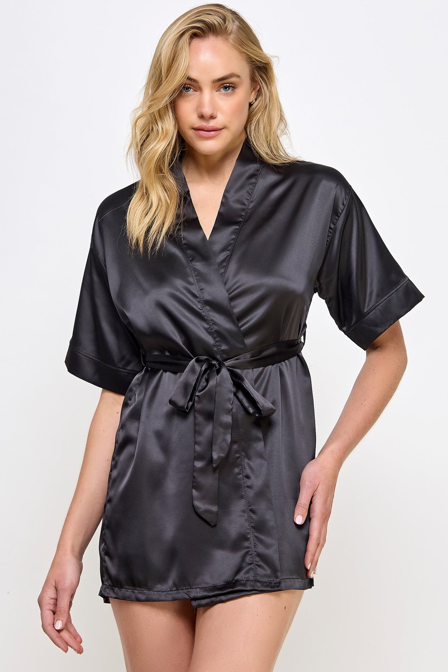 The Satin Lightweight Robe is the epitome of elegance and comfort, designed for those who appreciate the finer things in life. Crafted from premium satin, this robe boasts a sleek and smooth texture that feels luxurious against the skin. Its lightweight design ensures breathability and ease of movement, making it perfect for lounging in style or preparing for a day or evening out. Short length Open front Matching front tie satin belt
