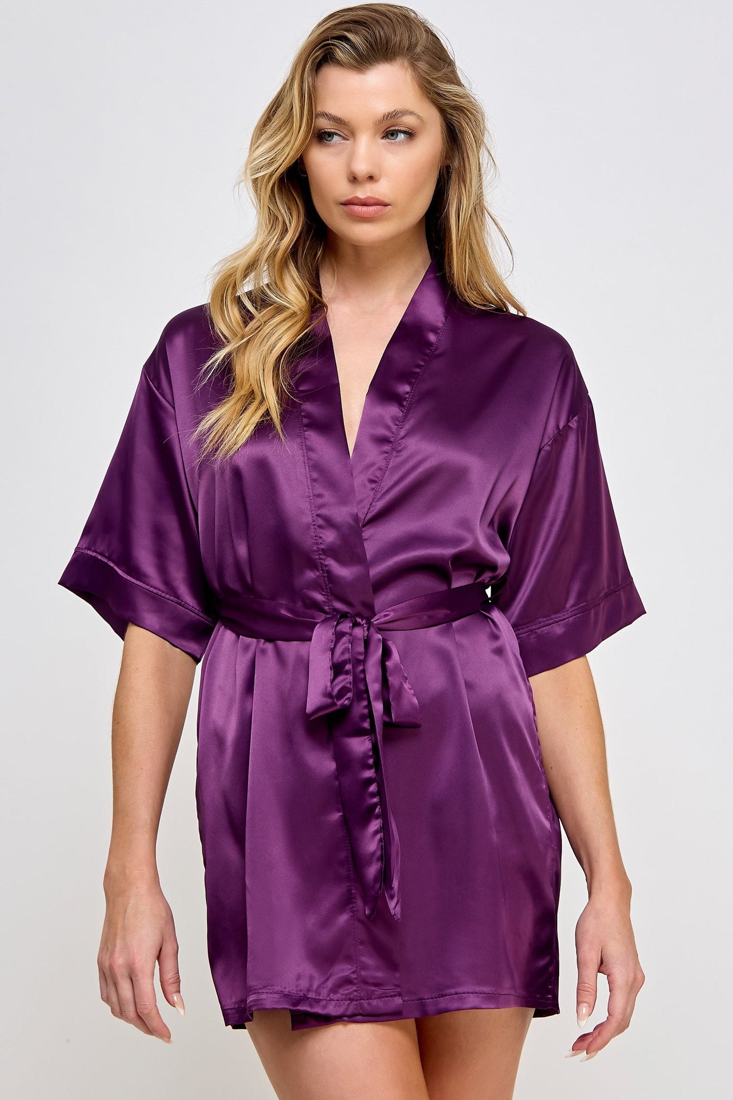 The Satin Lightweight Robe is the epitome of elegance and comfort, designed for those who appreciate the finer things in life. Crafted from premium satin, this robe boasts a sleek and smooth texture that feels luxurious against the skin. Its lightweight design ensures breathability and ease of movement, making it perfect for lounging in style or preparing for a day or evening out. Short length Open front Matching front tie satin belt