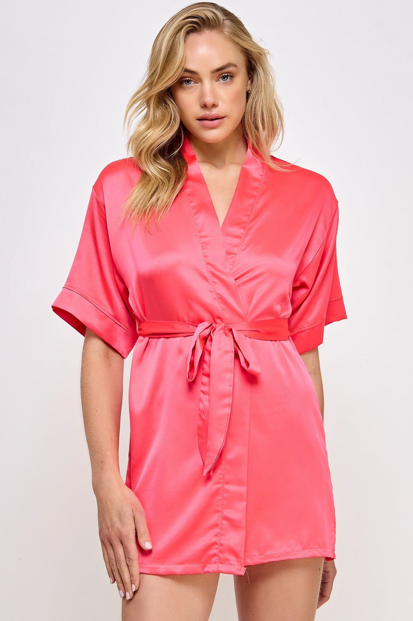 The Satin Lightweight Robe is the epitome of elegance and comfort, designed for those who appreciate the finer things in life. Crafted from premium satin, this robe boasts a sleek and smooth texture that feels luxurious against the skin. Its lightweight design ensures breathability and ease of movement, making it perfect for lounging in style or preparing for a day or evening out. Short length Open front Matching front tie satin belt
