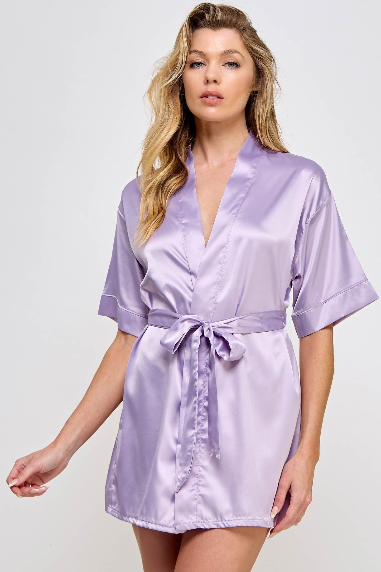 The Satin Lightweight Robe is the epitome of elegance and comfort, designed for those who appreciate the finer things in life. Crafted from premium satin, this robe boasts a sleek and smooth texture that feels luxurious against the skin. Its lightweight design ensures breathability and ease of movement, making it perfect for lounging in style or preparing for a day or evening out. Short length Open front Matching front tie satin belt