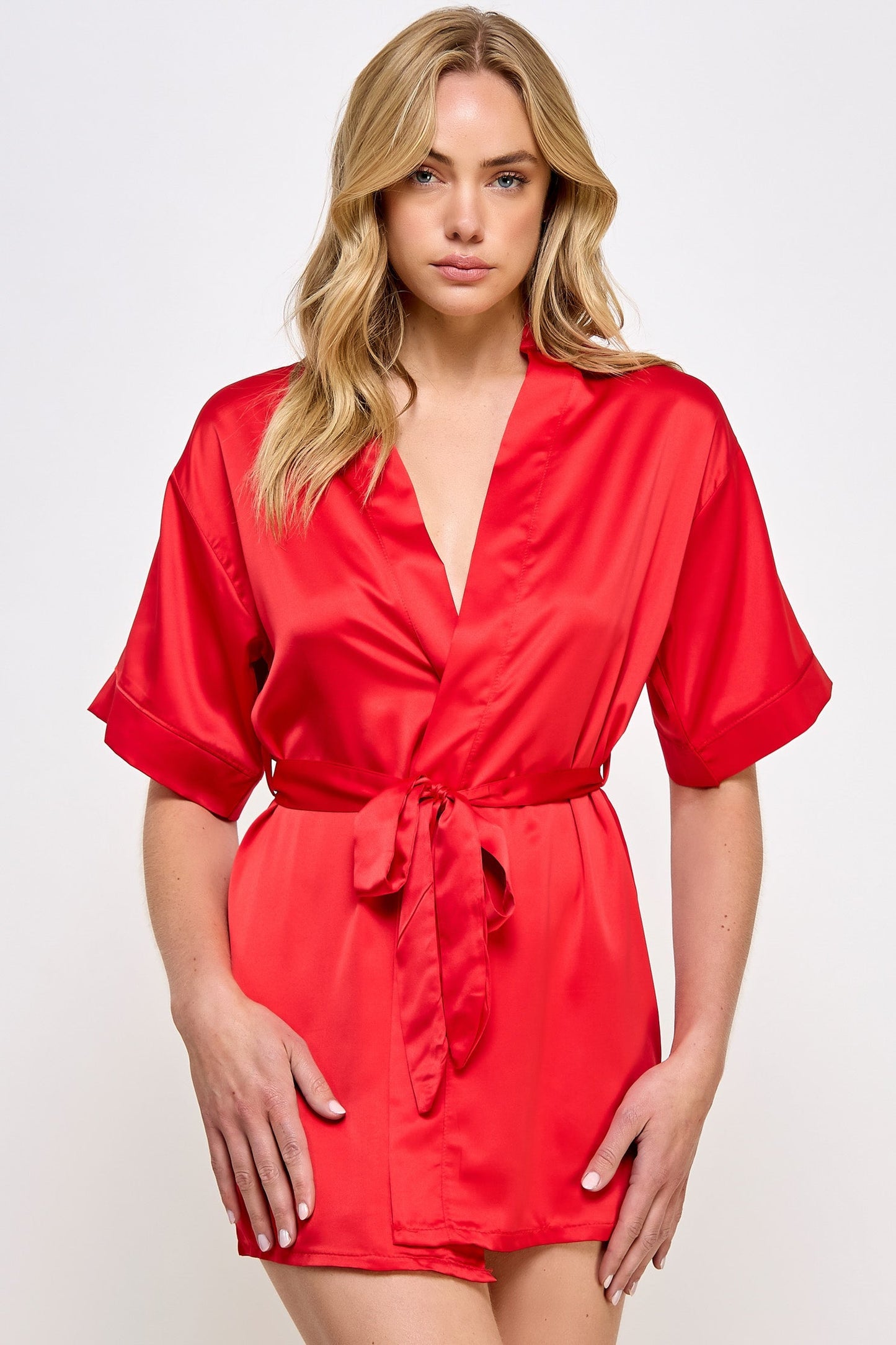 The Satin Lightweight Robe is the epitome of elegance and comfort, designed for those who appreciate the finer things in life. Crafted from premium satin, this robe boasts a sleek and smooth texture that feels luxurious against the skin. Its lightweight design ensures breathability and ease of movement, making it perfect for lounging in style or preparing for a day or evening out. Short length Open front Matching front tie satin belt