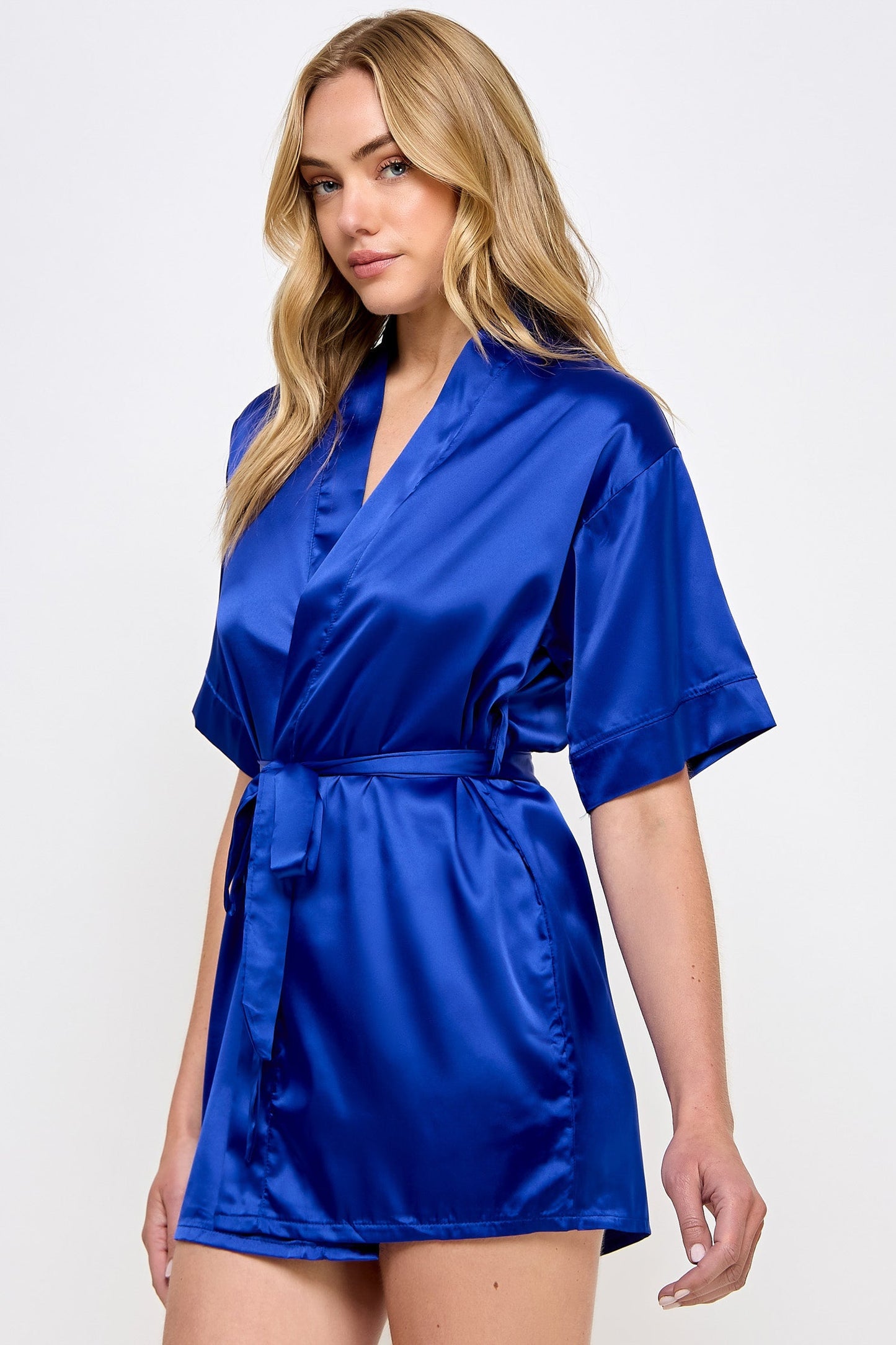 The Satin Lightweight Robe is the epitome of elegance and comfort, designed for those who appreciate the finer things in life. Crafted from premium satin, this robe boasts a sleek and smooth texture that feels luxurious against the skin. Its lightweight design ensures breathability and ease of movement, making it perfect for lounging in style or preparing for a day or evening out. Short length Open front Matching front tie satin belt