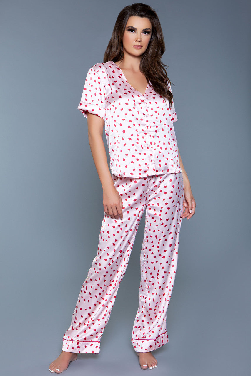 Wind down with this satin two-piece Camellia pajama set. Splotch Print Short sleeve V neckline Button-down closure Dolphin hem shirt Elastic waist pants Front satin drawstring Wide leg Decorative piping