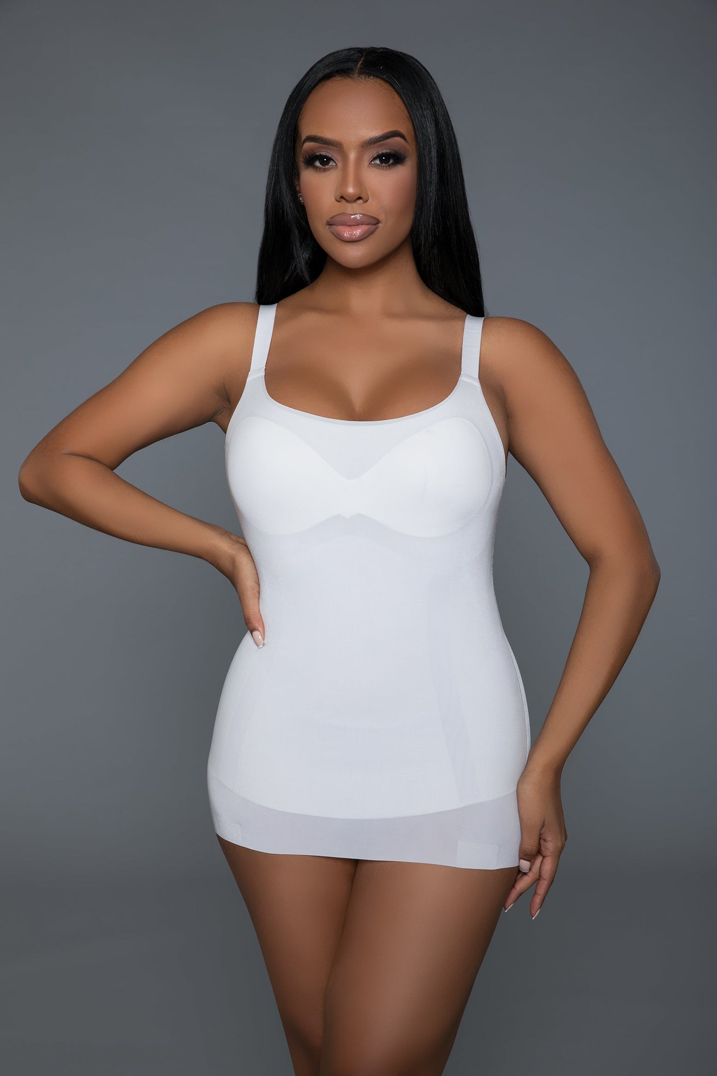 Achieve a flawless silhouette with the Stay Sexy Shaper Top, designed to enhance your natural curves while providing maximum comfort and support. This versatile shapewear features a removable foam cup to accommodate your preferred level of coverage and support. The tummy control panel smooths and flattens your midsection, while the innovative bust and butt lift design accentuates your figure, giving you a confident and sculpted look. Seamless round neckline Adjustable straps Removable one-piece foam cup bu