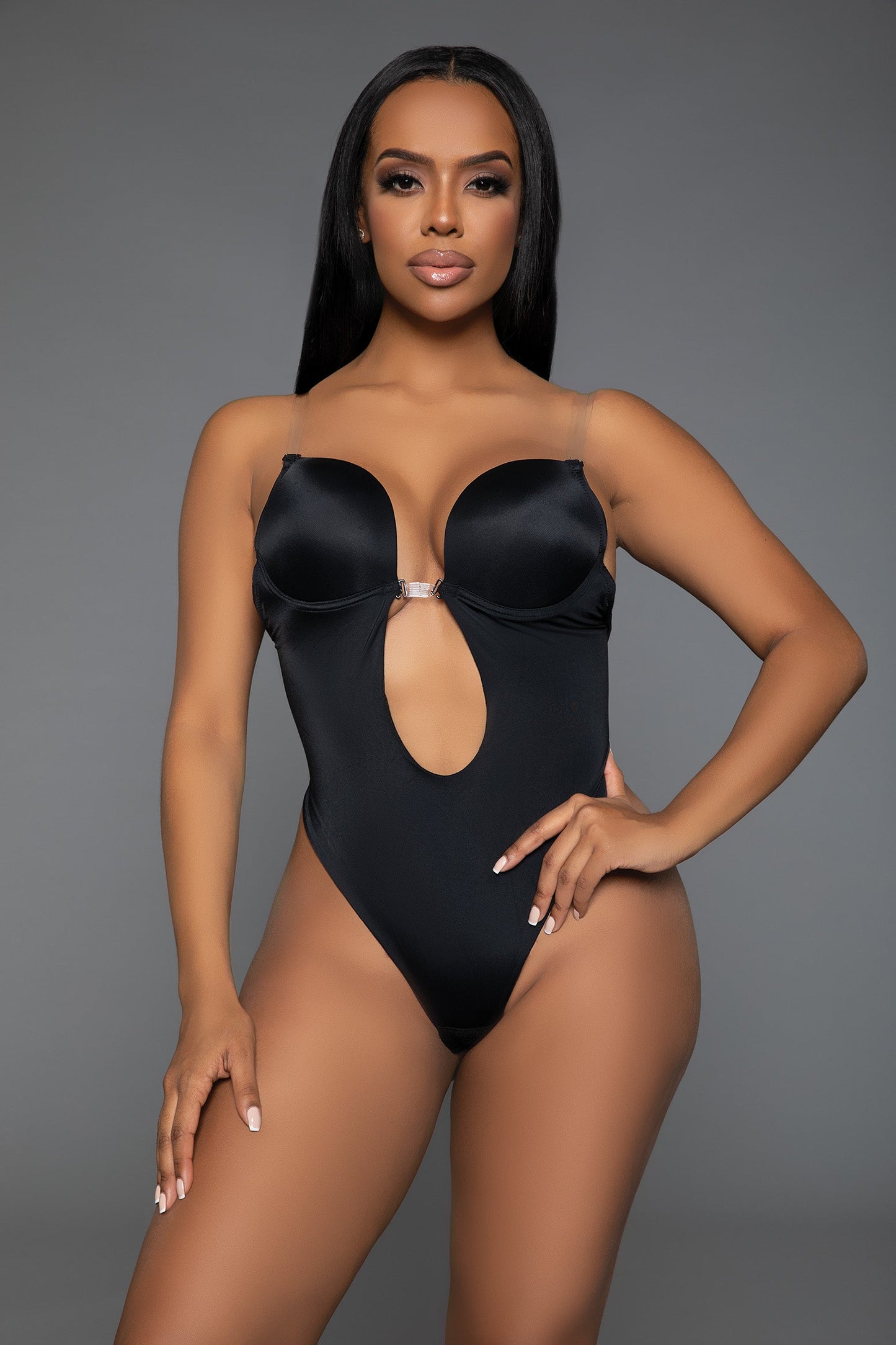 Embrace a stunning silhouette with our Looking Curvy Bodysuit Shaper. Designed with a deep U-neckline, this bodysuit offers a seductive plunge while providing optimal support with its built-in lifting cups. The open-back design ensures a seamless fit under any outfit, making it perfect for backless dresses and tops. Flexible clear removable and adjustable straps Lifting underwire cups Deep U plunging neckline with front hook closure Open back Thong-style bottom