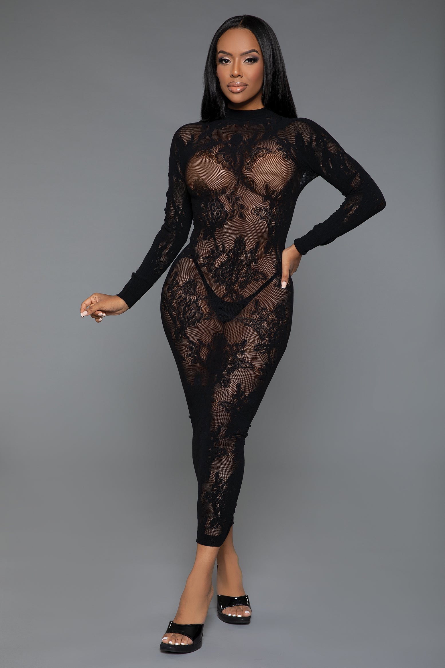 Step into the Innocent Touch Lace Maxi Dress Bodystocking and experience luxury, comfort, and style. It's not just an undergarment, it's a fashion statement that celebrates the beauty of lace and the power of a well-crafted silhouette. The delicate sheer floral lace shows what lies beneath creating a sensual yet elegant look. Mock neck Long sleeves Bodycon bodice Thong and pasties not included Handwash only, wash separately. Do not bleach/tumble dry/iron/dry clean. Be Wicked box packaging 93% Polyamide 7% 