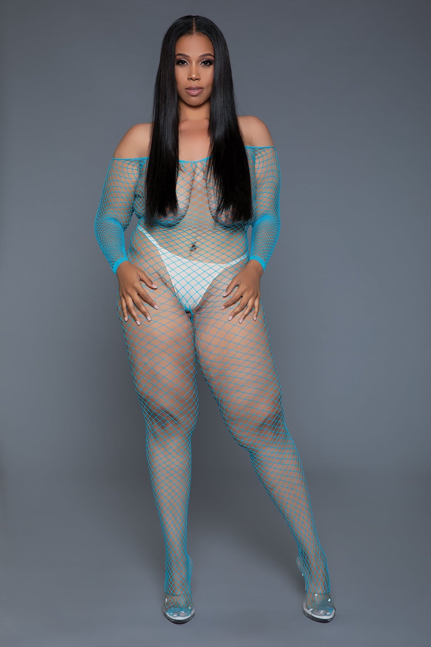 Unleash your daring side with our Catch Me Bodystocking, a statement piece designed for those who embrace bold fashion choices. This bodystocking combines the seductive appeal of fishnet with an off-shoulder cut, creating an attractive look that's as audacious as sensual. Long sleeves Off shoulder Fishnet from toe to shoulders Thong and pasties not included