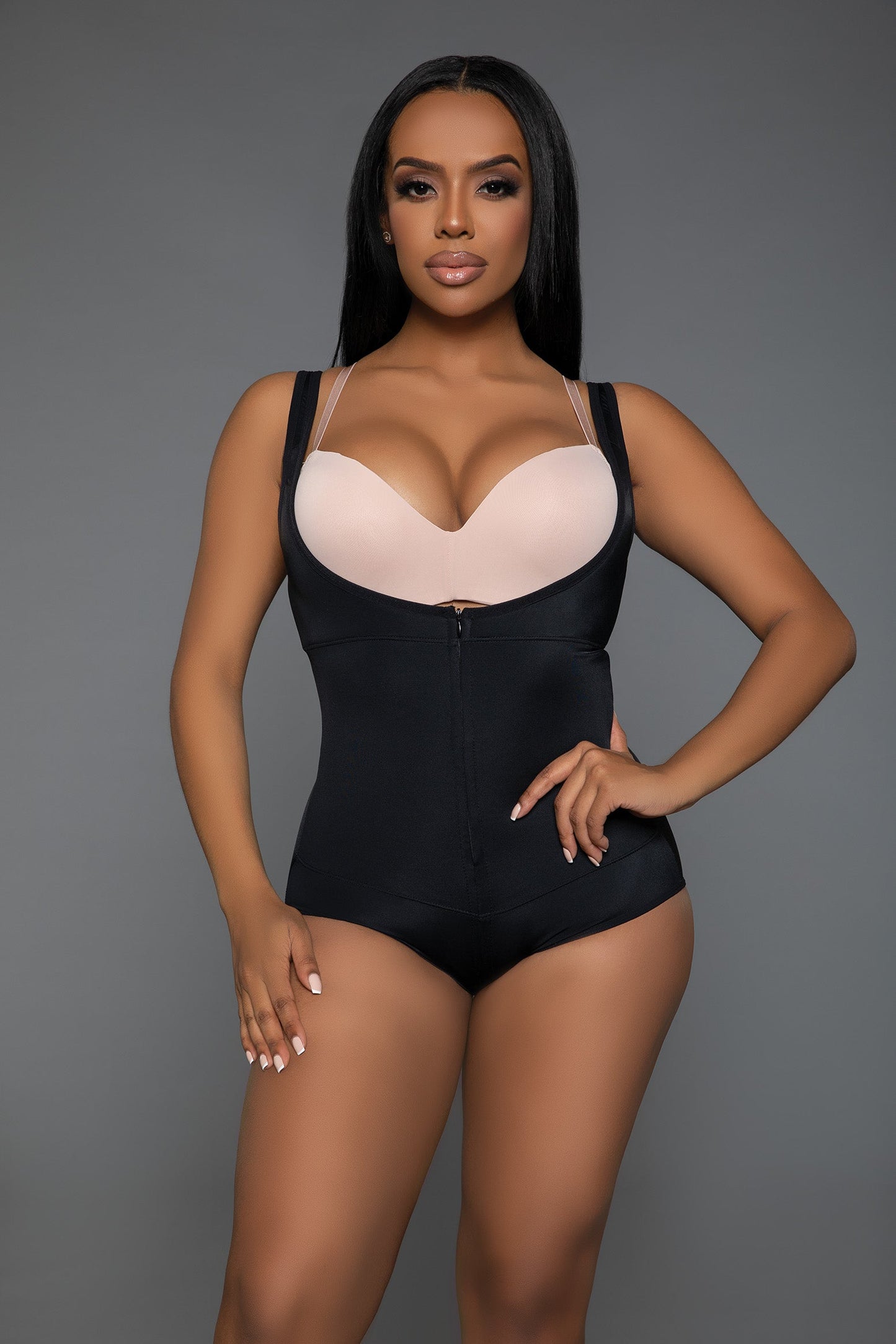 Your ultimate solution for a flawless, streamlined look under any outfit. Designed for those seeking both support and sophistication, this bodysuit shapewear combines innovative fabric technology with practical design elements to enhance your natural contours while providing unmatched comfort. Adjustable straps Open bust Lifting technology Front zipper closure
