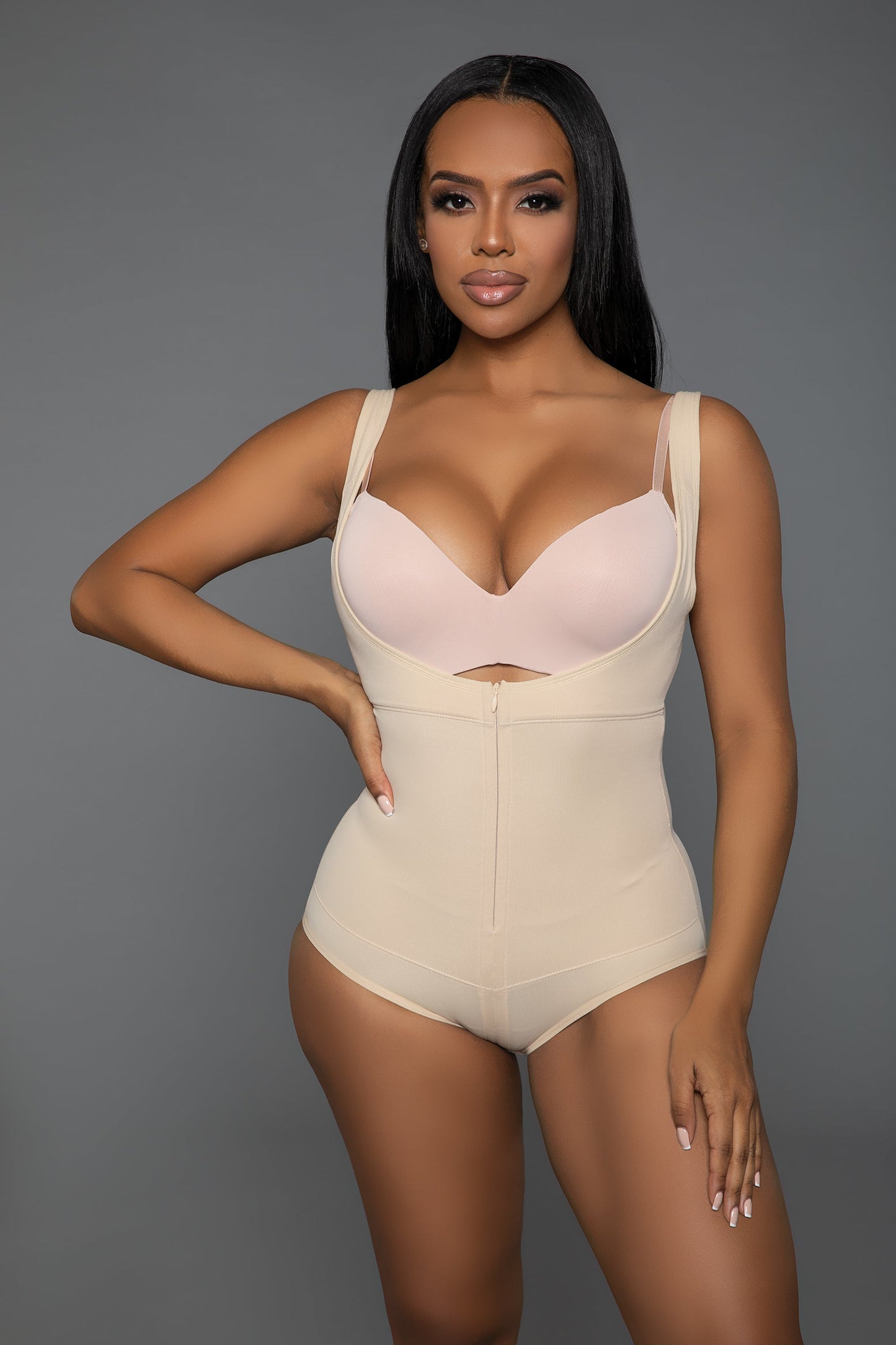 Your ultimate solution for a flawless, streamlined look under any outfit. Designed for those seeking both support and sophistication, this bodysuit shapewear combines innovative fabric technology with practical design elements to enhance your natural contours while providing unmatched comfort. Adjustable straps Open bust Lifting technology Front zipper closure