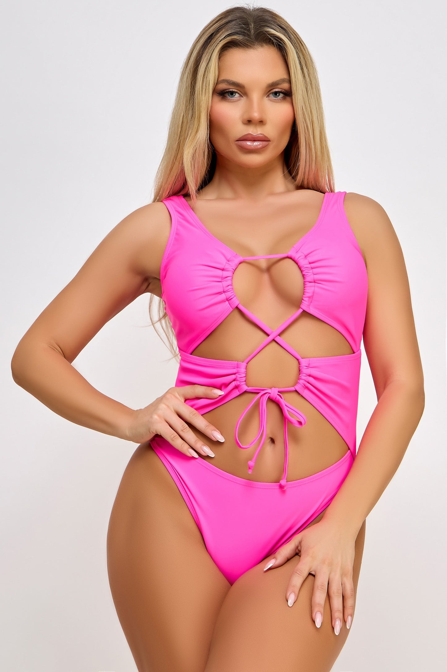 Channel timeless elegance with the Valery One-Piece Swimsuit, featuring a captivating lace-up front design that perfectly blends sophistication and allure. This swimsuit is designed for those who appreciate classic style with a modern twist, making it a must-have addition to your swimwear wardrobe. Lace-up deep plunge neckline that can be adjusted Padded Medium coverage bottom Shell: 82% Nylon 18% Spandex Lining: 92% Poly 8% Spandex Made in China