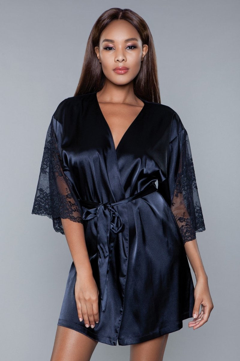 The Grace robe with lace panels is a luxurious and sophisticated piece, perfect for adding a touch of elegance to your loungewear collection. Crafted from smooth, high-quality satin, this robe glides over the skin with an effortless grace, providing a feeling of indulgence and comfort. Open front Sheer floral lace panel design 3/4 lace sleeves Matching front tie satin belt