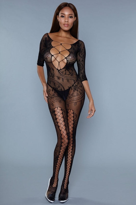 Discover the epitome of femininity with our Fire & Desire Bodystocking, a garment designed to enhance the silhouette adding sensual allure. This exquisite piece, adorned with delicate floral lace patterns and seductive lace-up details, offers a blend of sophistication and allure that's hard to resist. Plunging lace-up neckline Long sleeves Front leg lace-up design Follow care instructions Thong not included Be Wicked box packaging, dimensions (in): 10x7x1 Made in Taiwan Nylon 92% Spandex 8%
