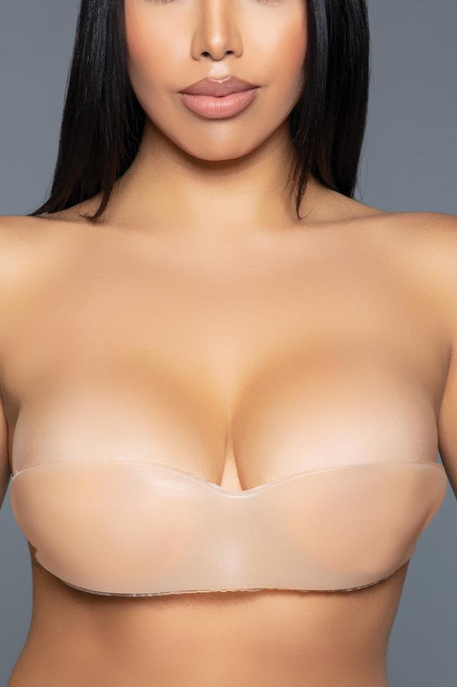 The Wing Shape Silicone Bra is an innovative and discreet undergarment designed to provide both support and freedom, allowing you to wear backless, strapless, and low-cut outfits with confidence. Crafted from high-quality, skin-friendly silicone, this bra adheres securely to your skin, offering a natural lift and shape without visible straps or bands. One-piece silicone bra Back adhesive Do not wear for extended periods/overnight. Not recommended for individuals with sensitive skin. Do not apply to open cu