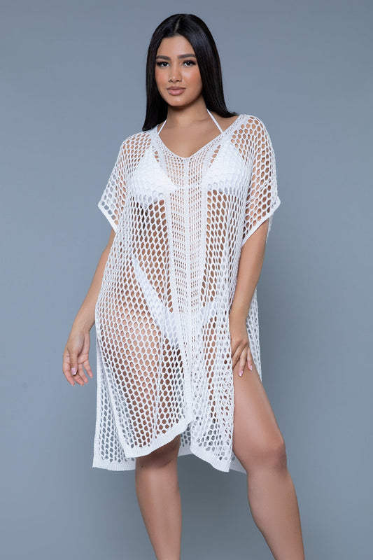 The Madelyn Crochet Caftan Poncho Cover-Up combines boho elegance with beach-ready charm. Featuring an intricate crochet design, this lightweight cover-up offers breathable comfort and a relaxed fit. The poncho-style silhouette drapes beautifully, making it the perfect layer over your favorite swimwear. With its versatile design, the Madelyn Cover-Up transitions effortlessly from a day at the beach to casual seaside gatherings, adding a touch of effortless sophistication to your summer wardrobe. V neckline