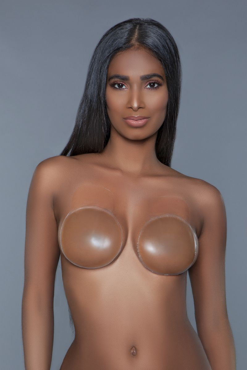 Round silicone nipple cover is a state-of-the-art solution designed for those seeking both discretion and support in their intimate wear. This innovative product features a round shape that adds a seamless touch but also ensures comprehensive coverage and a natural lift to the bust. Environmentally healthy adhesive back Thin edge design Seamless Flexible Water-resistant Skid-resistant Sizes: S/M: 8CM M/L: 10CM