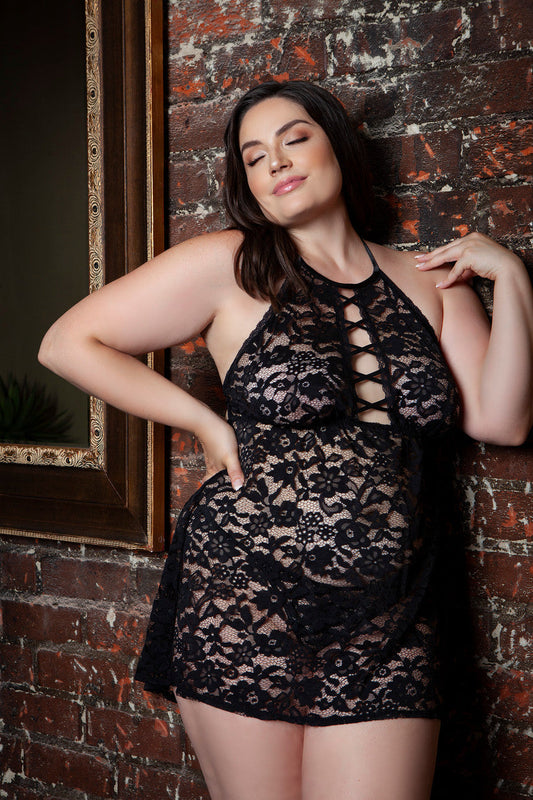 The Halter Lace Babydoll set with Lace-Up Detail is a breathtaking piece of lingerie that combines the timeless elegance of floral lace with a flirtatious halter neckline and seductive lace-up detailing. This babydoll set is designed to accentuate the figure, featuring a sheer lace bodice that flows gracefully, offering a flattering silhouette. Back tie halter high neckline Front lace-up plunging design Sleeveless Open back hook and eye closure Matching thong