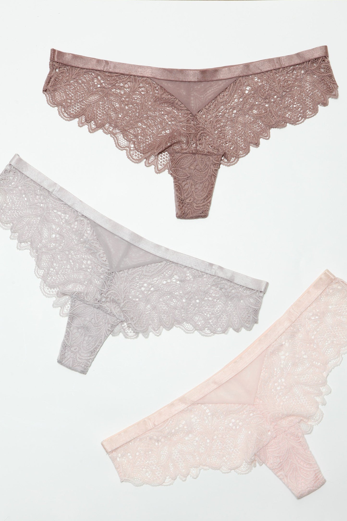 Introduce a touch of allure to your lingerie collection with our Wren Cheeky Pack. Designed for those who love to blend sophistication with a hint of seduction, these panties feature exquisite lace detailing that complements the cheeky cut, offering a perfect balance of coverage and reveal. Low-rise Delicate lace pattern Elastic waist Scalloped hem Cotton gusset liner Hanger with Be Wicked hangtag, 3-pack label, size label, hygienic liner, and UPC stickers in a polybag. Made in China