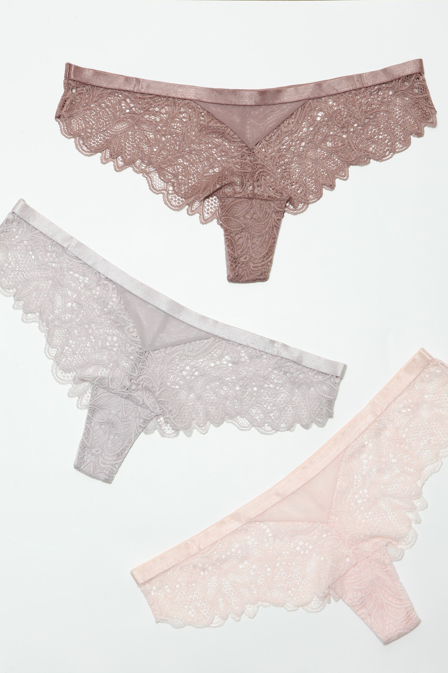 Introduce a touch of allure to your lingerie collection with our Wren Cheeky Pack. Designed for those who love to blend sophistication with a hint of seduction, these panties feature exquisite lace detailing that complements the cheeky cut, offering a perfect balance of coverage and reveal. Low-rise Delicate lace pattern Elastic waist Scalloped hem Cotton gusset liner Hanger with Be Wicked hangtag, 3-pack label, size label, hygienic liner, and UPC stickers in a polybag. Made in China