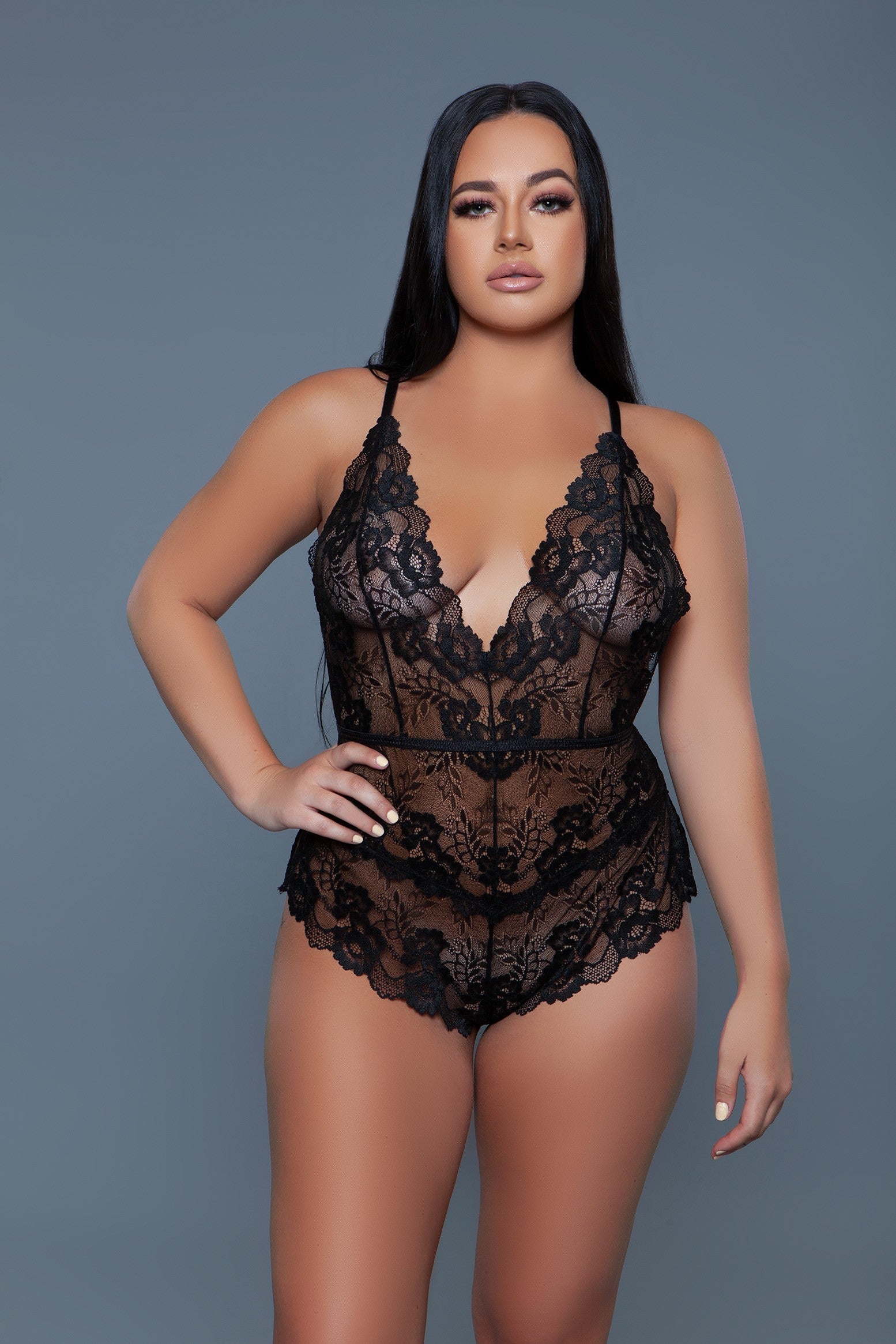Elegant lace bodysuit, designed to showcase the intricate beauty and delicate craftsmanship of floral lace fabric. It's lace brings a fine quality, with detailed floral patterns that offer a glimpse of the skin beneath, creating a balance between elegance and allure. Plunging neckline Adjustable crisscross spaghetti straps Lower back keyhole design Scalloped hem Side slits Cheeky bottom Machine wash warm with like colors on delicate cycle. Do not bleach/tumble dry/iron/dry clean. Be Wicked box packaging