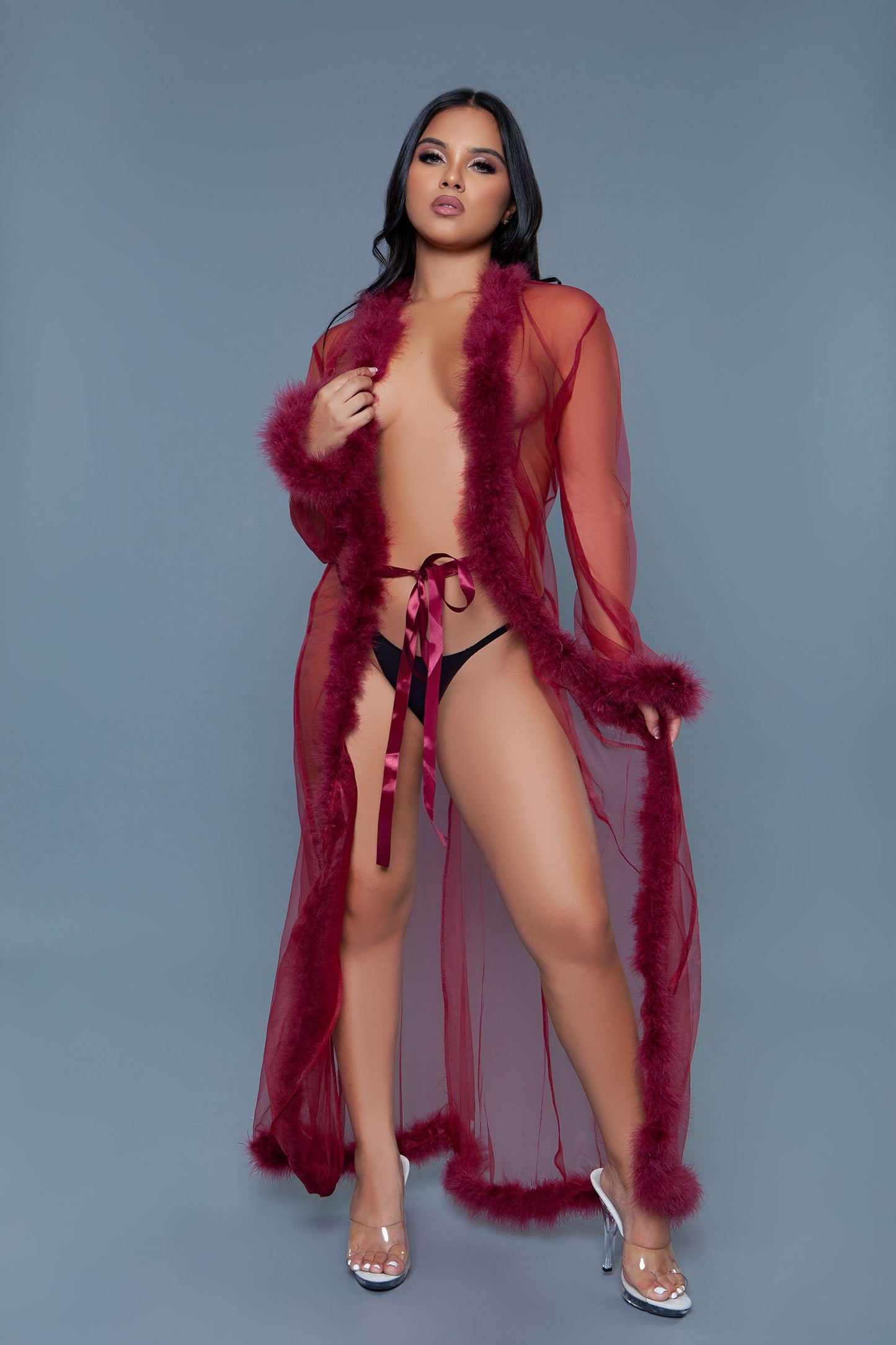 Full length chiffon robe with faux fur trim is a chic and elegant addition to any loungewear collection, blending the lightness of chiffon with the luxurious touch of faux fur. A satin ribbon that ties at the front Long sleeves Faux fur trim on hem and cuffs Thong not included Be Wicked Polybag with tags and UPC stickers.