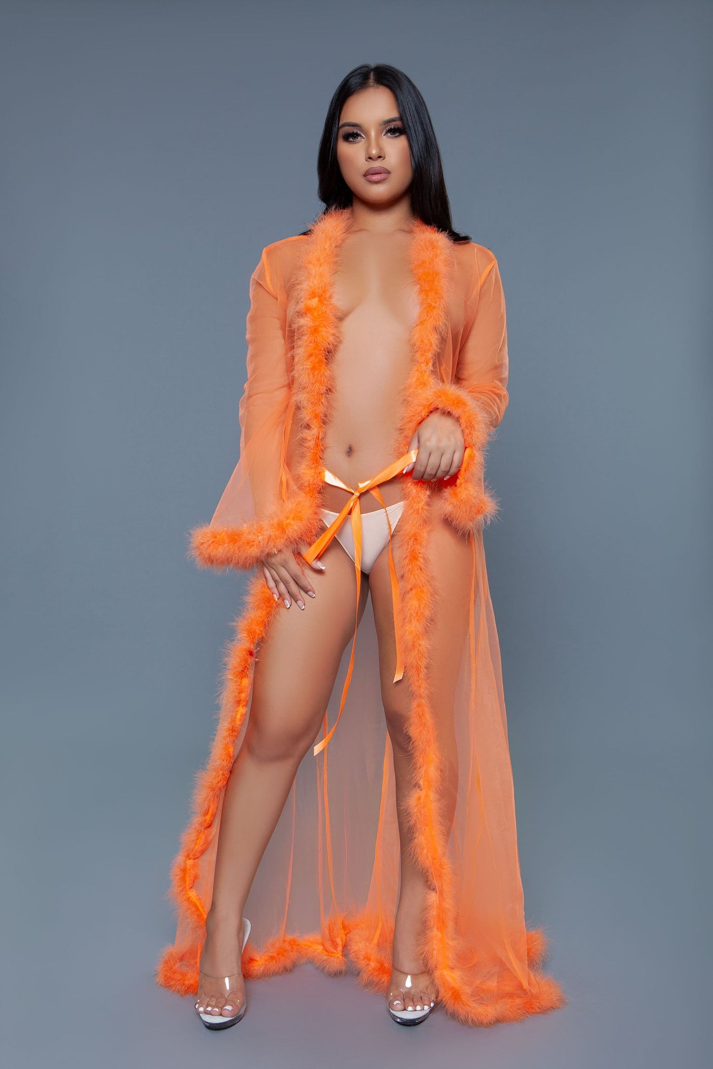 Full length chiffon robe with faux fur trim is a chic and elegant addition to any loungewear collection, blending the lightness of chiffon with the luxurious touch of faux fur. A satin ribbon that ties at the front Long sleeves Faux fur trim on hem and cuffs Thong not included Be Wicked Polybag with tags and UPC stickers.