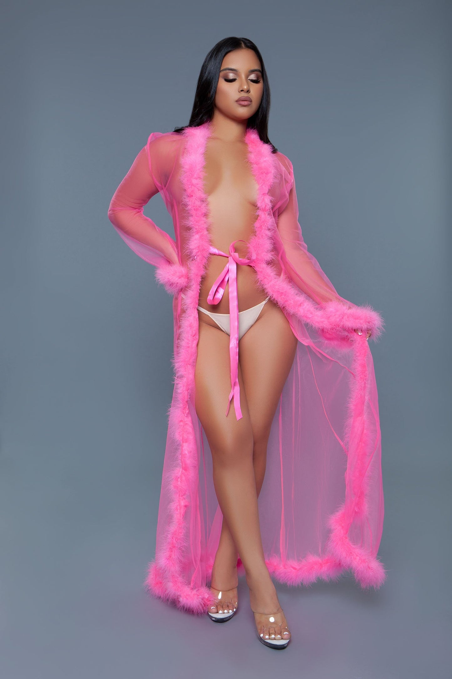 Full length chiffon robe with faux fur trim is a chic and elegant addition to any loungewear collection, blending the lightness of chiffon with the luxurious touch of faux fur. A satin ribbon that ties at the front Long sleeves Faux fur trim on hem and cuffs Thong not included Be Wicked Polybag with tags and UPC stickers.