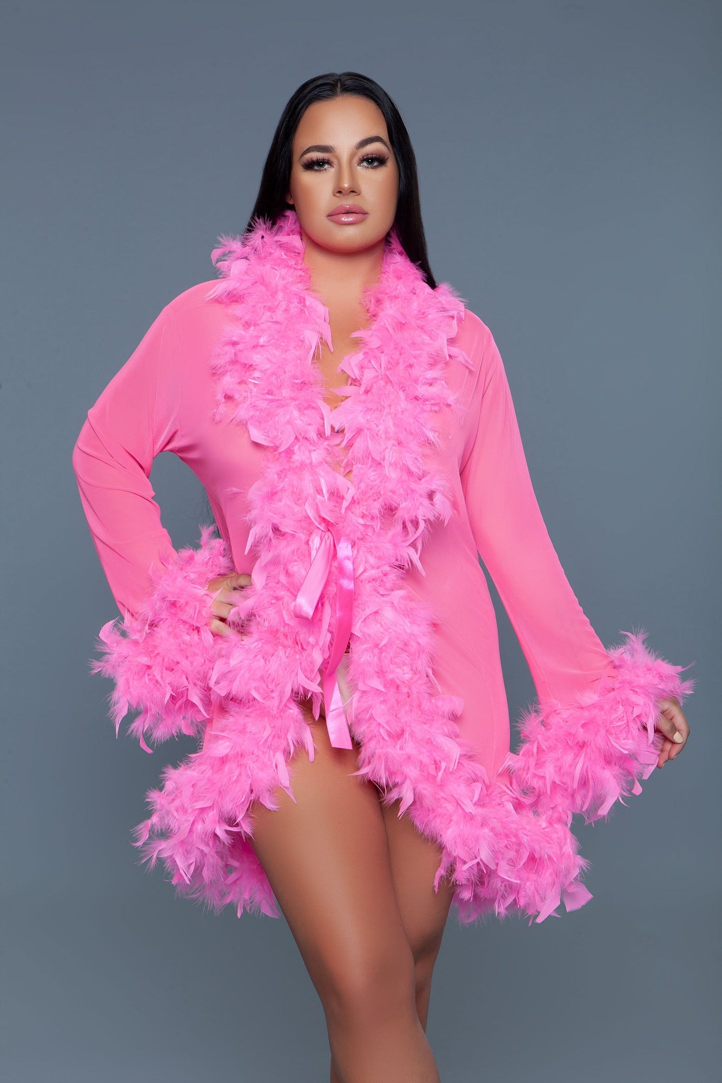 Lux short chiffon robe with feather boa trim is a playful yet elegant garment that combines the airy lightness of chiffon with the whimsical allure of a feather boa trim. This robe is designed for those who love to add a touch of glamour and fun to their loungewear. Sheer Feather trim Long sleeves Front tie satin ribbons Thong not included. Be Wicked polybag with Be Wicked hand tag and UPC stickers.