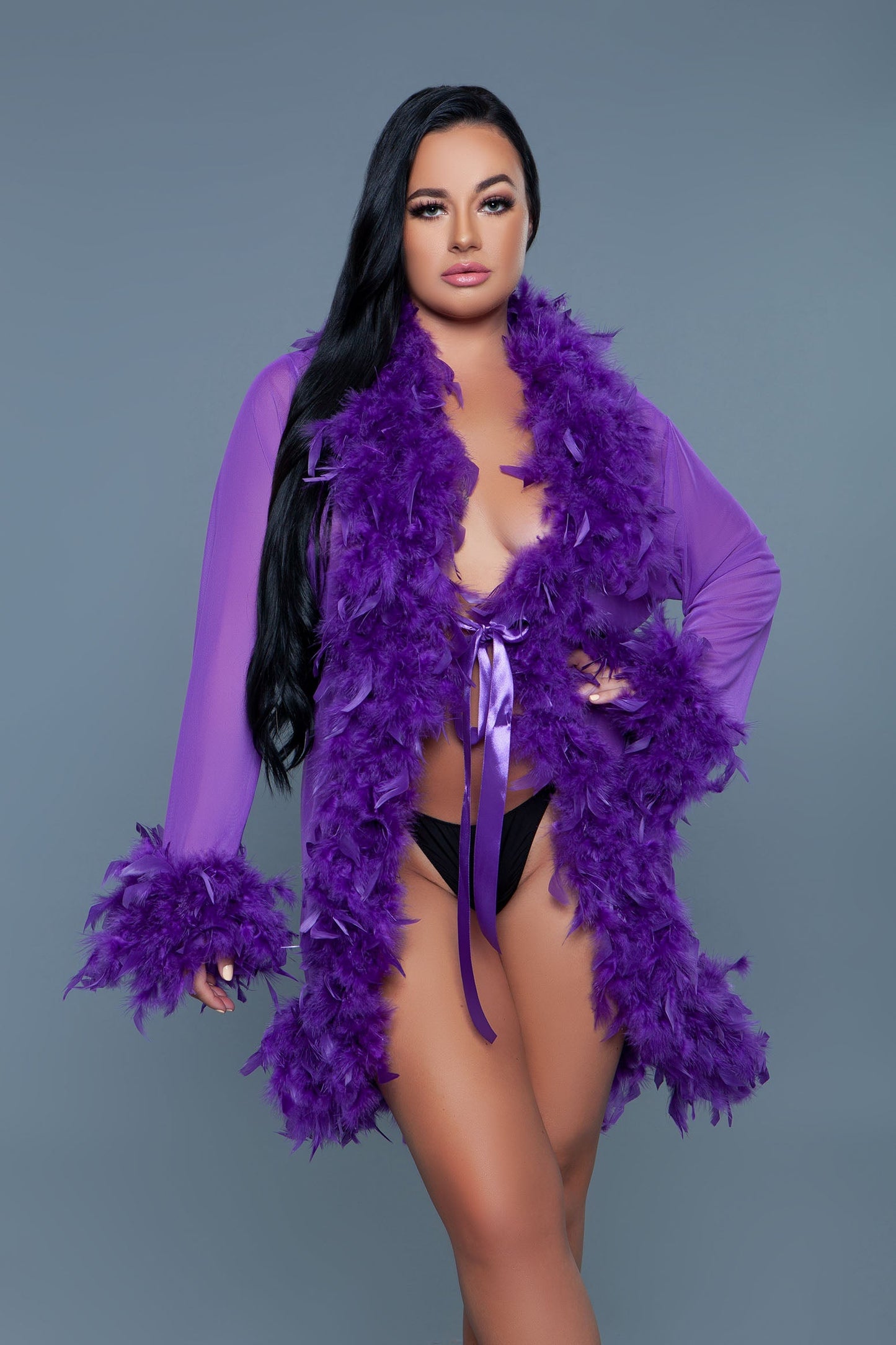 Lux short chiffon robe with feather boa trim is a playful yet elegant garment that combines the airy lightness of chiffon with the whimsical allure of a feather boa trim. This robe is designed for those who love to add a touch of glamour and fun to their loungewear. Sheer Feather trim Long sleeves Front tie satin ribbons Thong not included. Be Wicked polybag with Be Wicked hand tag and UPC stickers.