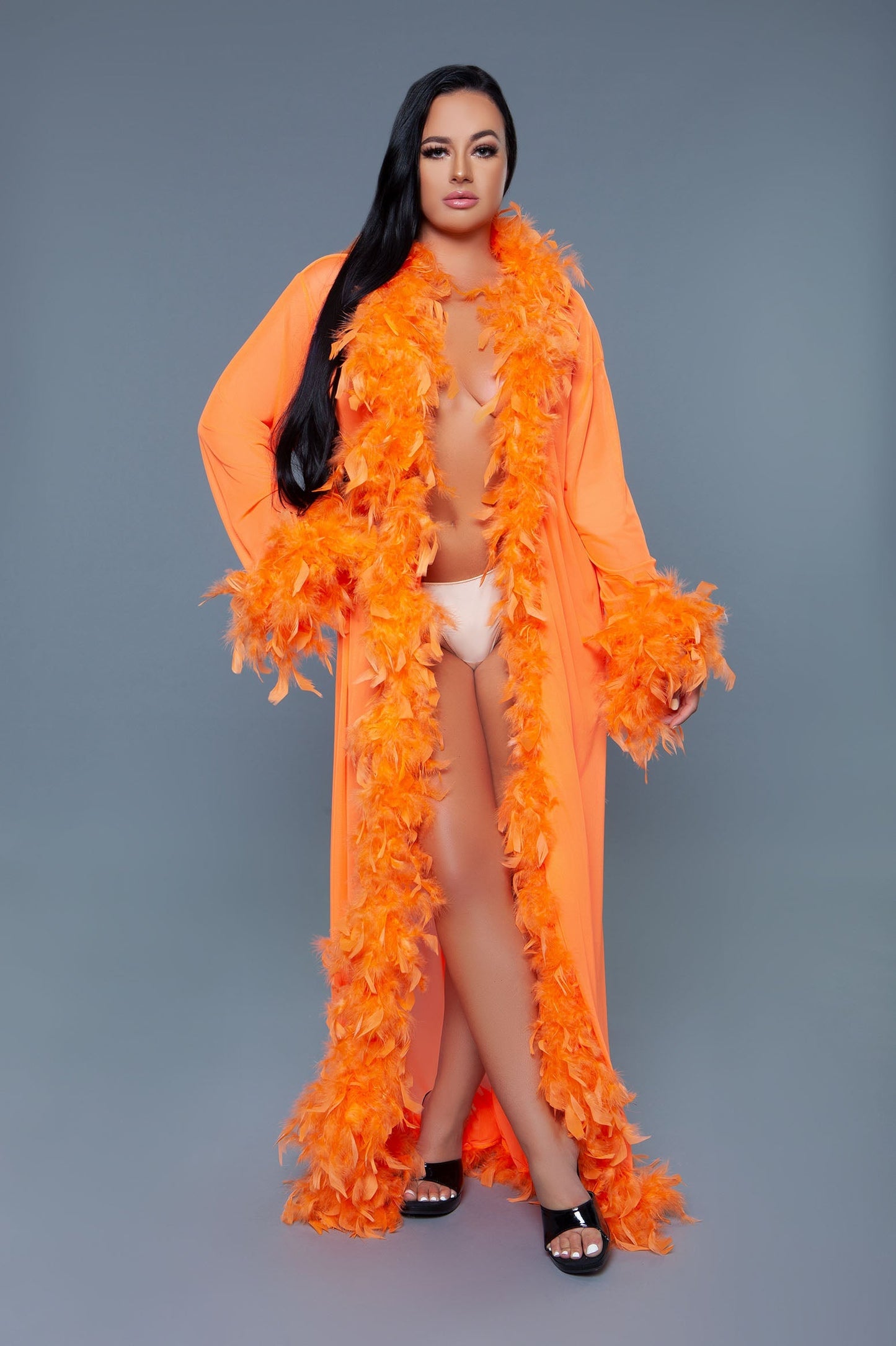 Long Glamour chiffon robe with feather boa trim is a playful yet elegant garment that combines the airy lightness of chiffon with the whimsical allure of a feather boa trim. This robe is designed for those who love to add a touch of glamour and fun to their loungewear. Sheer Feather trim Long sleeves Front tie satin ribbons Thong not included. Be Wicked polybag with Be Wicked hand tag and UPC stickers.