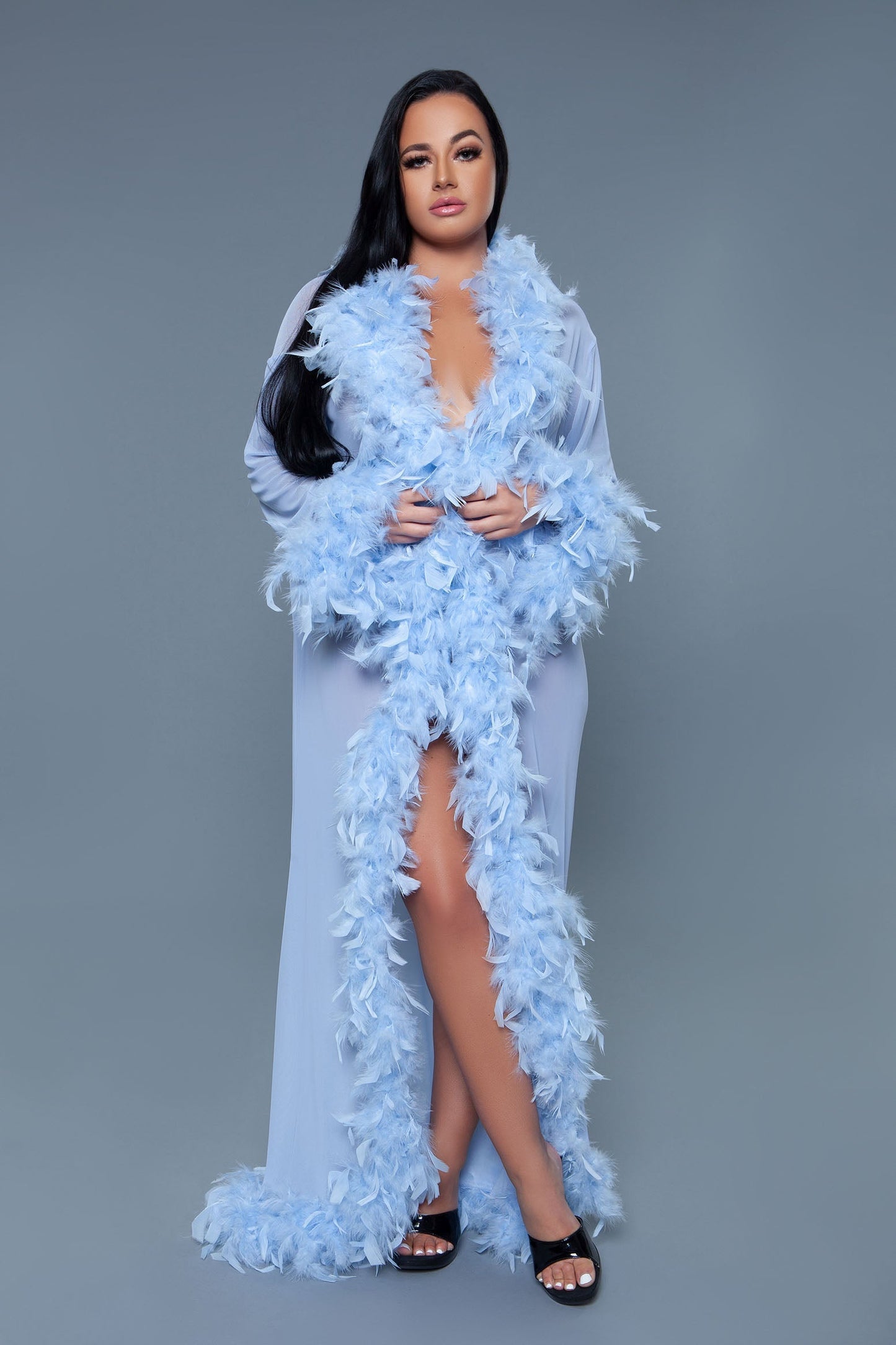 Long Glamour chiffon robe with feather boa trim is a playful yet elegant garment that combines the airy lightness of chiffon with the whimsical allure of a feather boa trim. This robe is designed for those who love to add a touch of glamour and fun to their loungewear. Sheer Feather trim Long sleeves Front tie satin ribbons Thong not included. Be Wicked polybag with Be Wicked hand tag and UPC stickers.