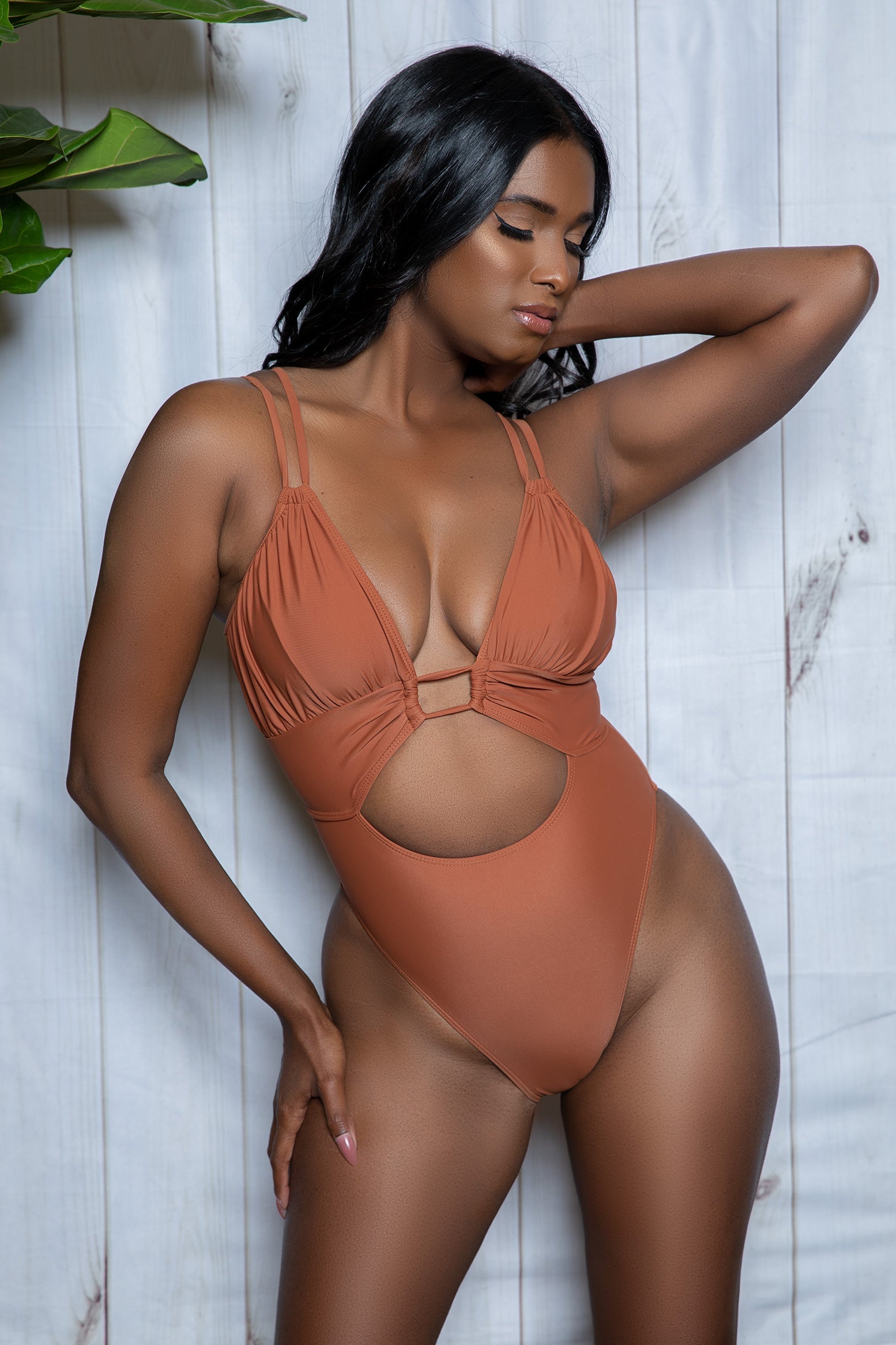 Embrace the sun in style with the Evelyn Strappy One-Piece Swimsuit, where elegance meets comfort. Featuring a sleek, sophisticated silhouette enhanced with intricate strappy details, this suit is as flattering as it is captivating. Caged Plunge neckline Padded top Front waist keyhole Adjustable shoulder straps Back hook and eye closure High-cut Brazilian bottom Hand wash in cold water. Do not bleach. Dry in the shade. Do not iron. Do not dry clean. Be Wicked Swimwear Polybag Packaging Made in China 86% Ny