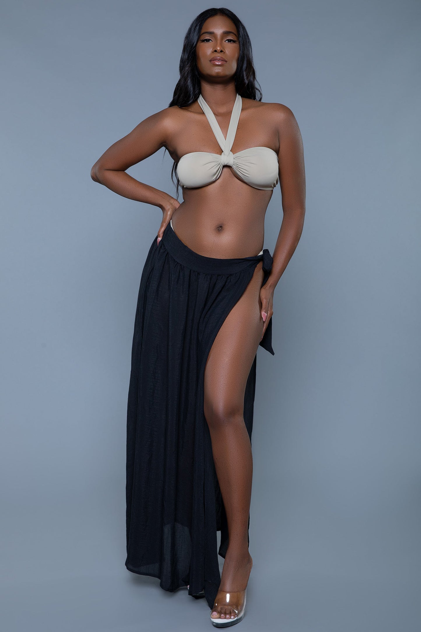 The Claire Gathered Side-Tie Maxi Cover-Up Skirt is a must-have for effortless beachside glamour. Made from lightweight, semi-sheer fabric, this skirt features a gathered design with a side tie, offering an adjustable fit and a touch of elegance. The flowy maxi length and breezy silhouette make it perfect for layering over swimwear. Whether you're lounging by the pool or taking a seaside stroll, the Claire Cover-Up Skirt adds a stylish and sophisticated touch to your summer wardrobe. Waist side tie Flatter